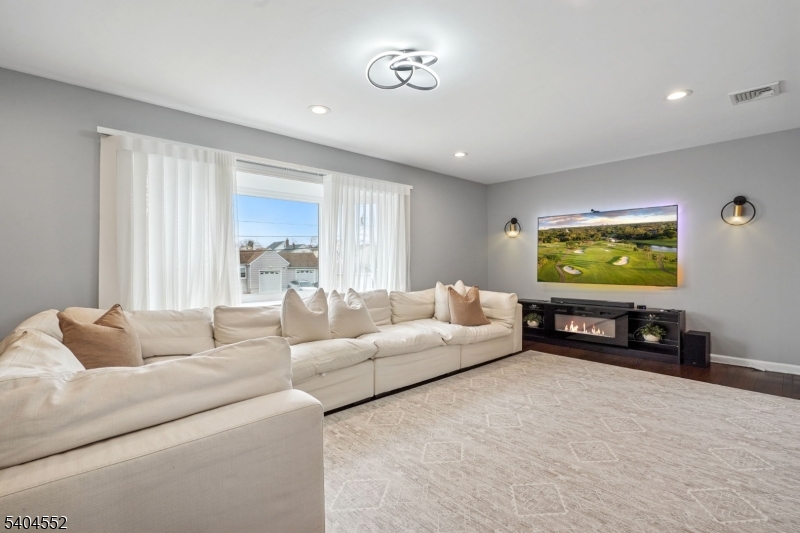2389 Steuben Street Union, NJ 07083 - Photo 3 of 27 a living room with furniture and a flat screen tv