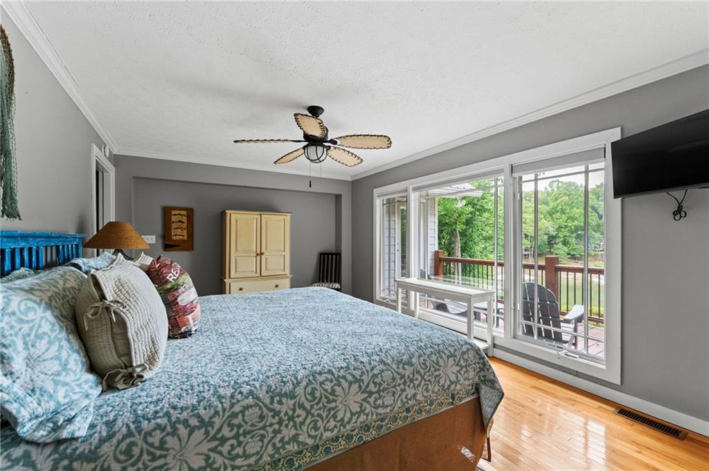 221 Reece Creek Road West Blairsville, GA 30512 - Photo 27 of 42 a bedroom with a large bed and a large window