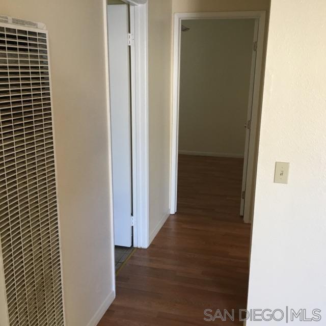 2356 Central Spring Valley Spring Valley, CA 91977 - Photo 13 of 16 a view of a hallway with wooden floor