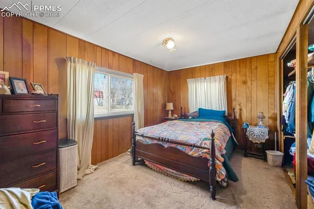 a bed room with a bed and a window