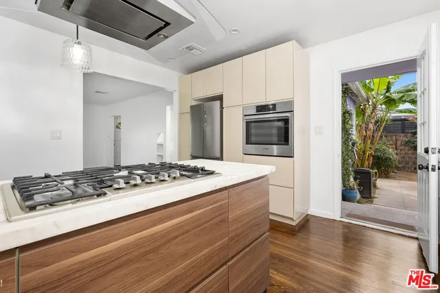 a kitchen with a stove and a refrigerator