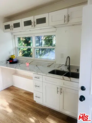 a kitchen with a sink and a window
