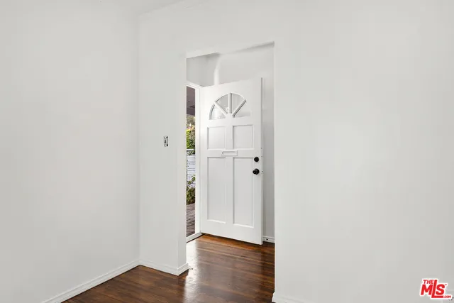 a view of a livingroom with wooden floor