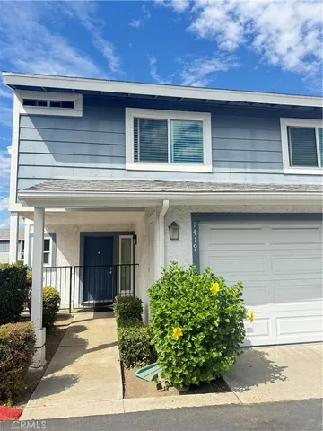 a front view of a house with garage