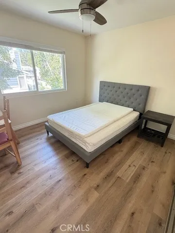 a bedroom with a bed and window