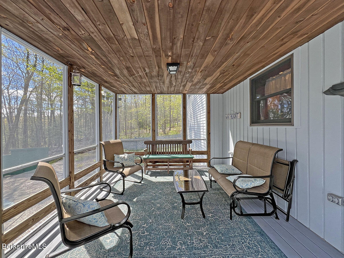 7 Stonebridge Way Tyringham, MA 01238 - Photo 39 of 46 SCREEN PORCH WITH POOL VIEW