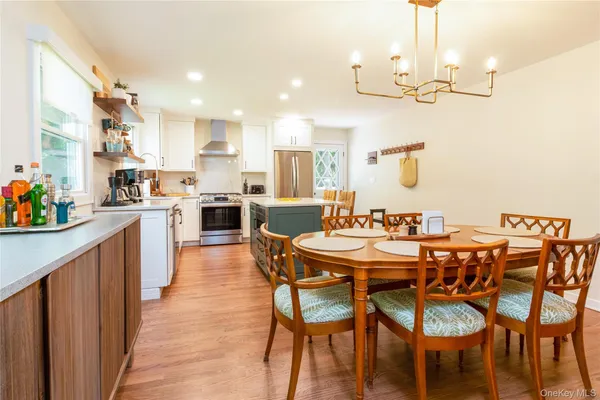 a large kitchen with a table and chairs