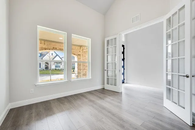 a kitchen with stainless steel appliances a sink a stove top oven a counter space and cabinets