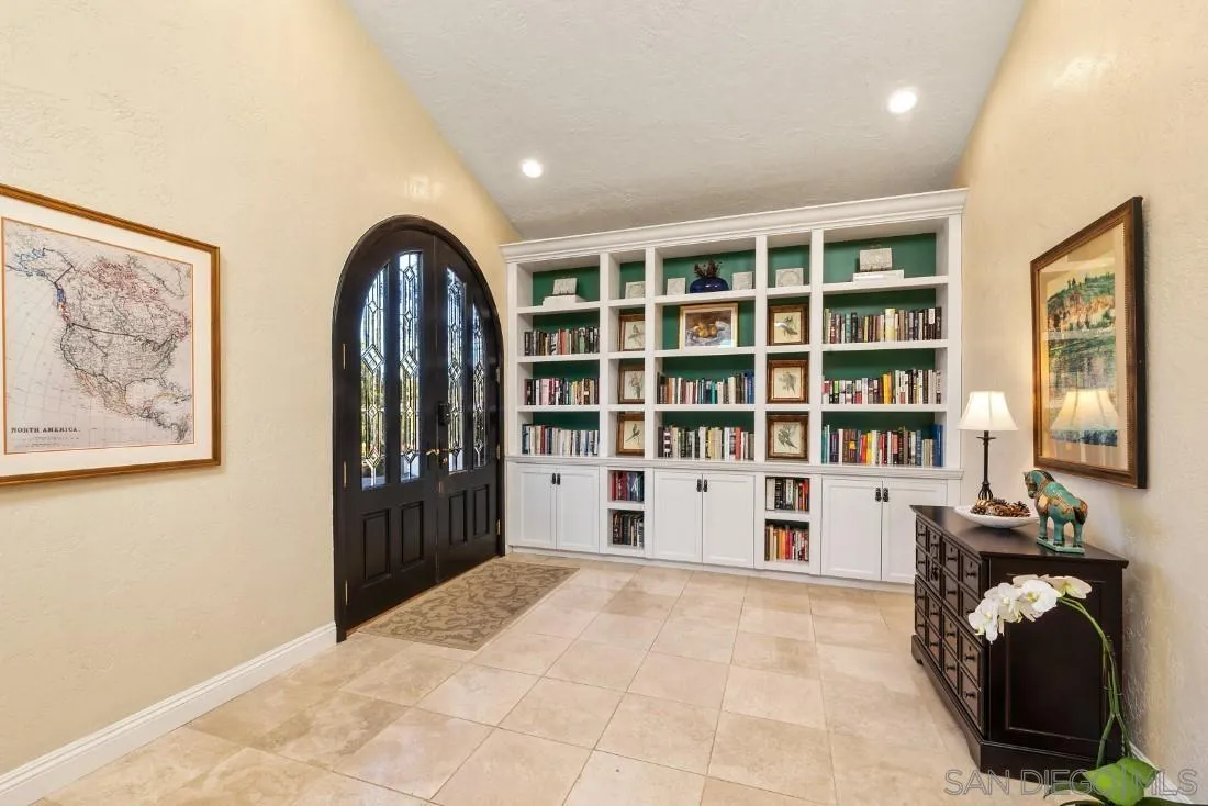 16033 Stoney Acres Road Poway, CA 92064 - Photo 11 of 60 a view of a livingroom with workspace and a window