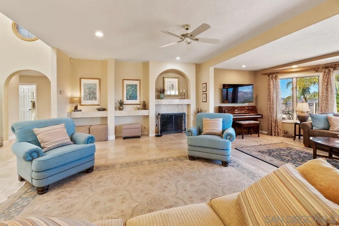 16033 Stoney Acres Road Poway, CA 92064 - Photo 14 of 60 a living room with furniture and a fireplace