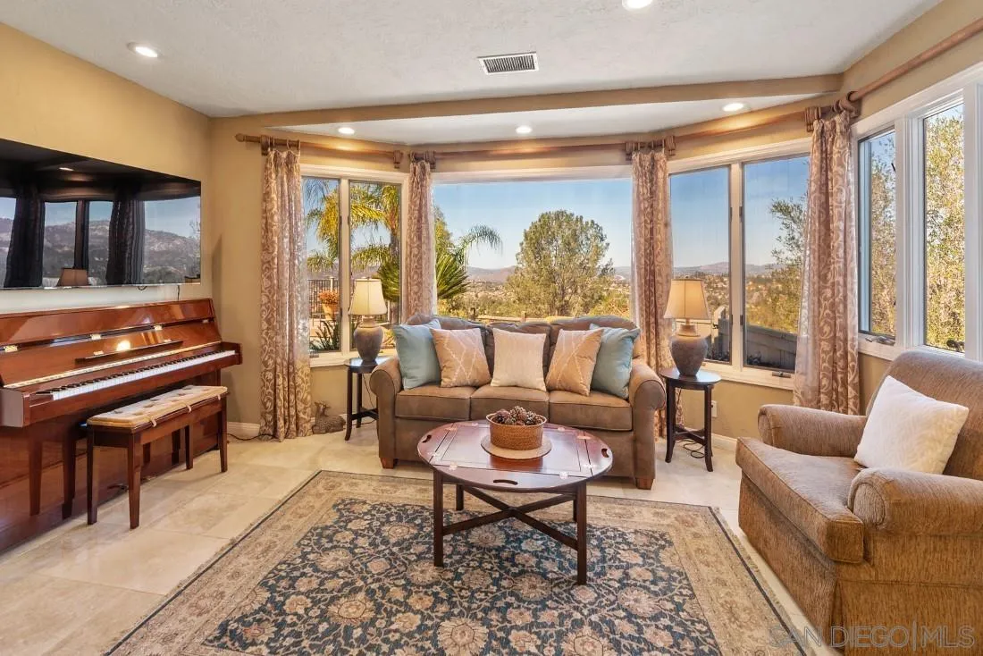 16033 Stoney Acres Road Poway, CA 92064 - Photo 15 of 60 a living room with furniture and a large window