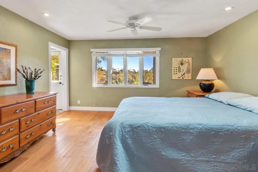 16033 Stoney Acres Road Poway, CA 92064 - Photo 25 of 60 a bedroom with a large bed and a dresser