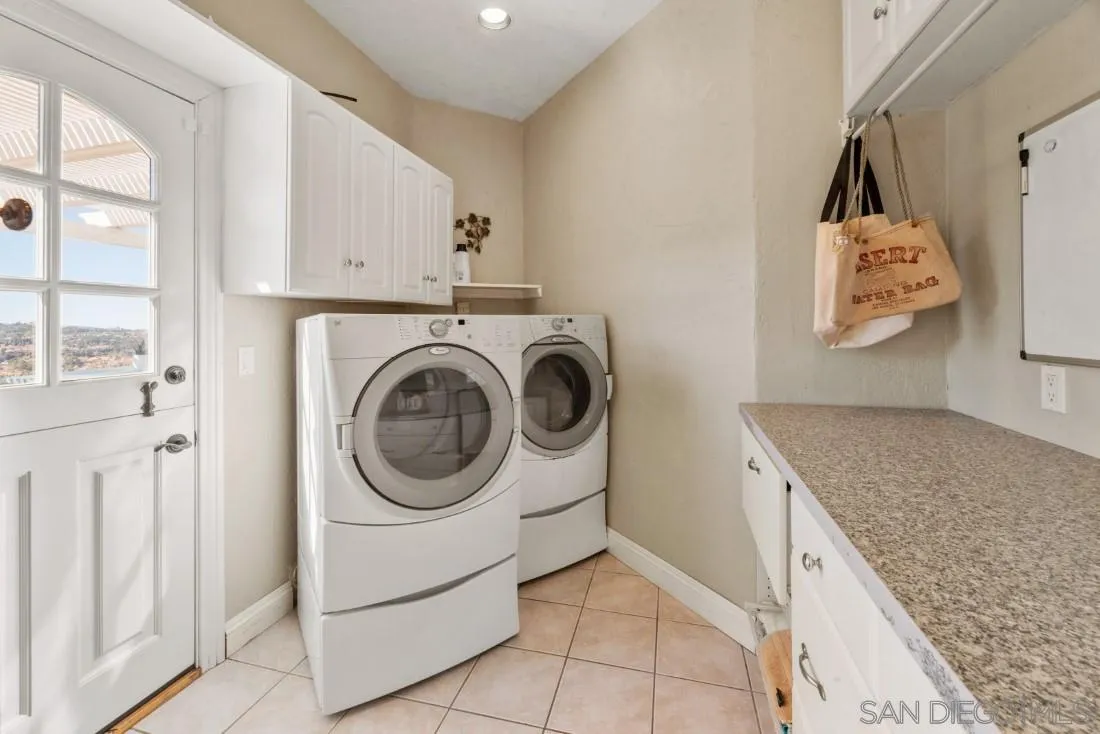 16033 Stoney Acres Road Poway, CA 92064 - Photo 39 of 60 a utility room with sink dryer and washer