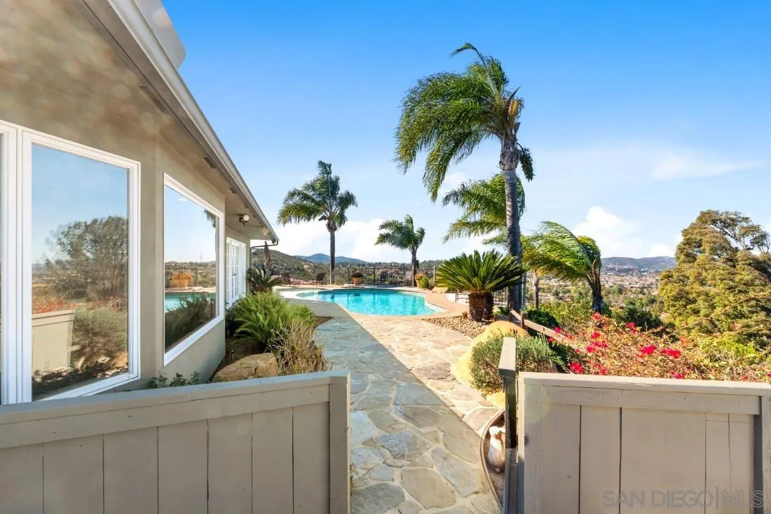 16033 Stoney Acres Road Poway, CA 92064 - Photo 41 of 60 a view of a house with a yard and potted plants