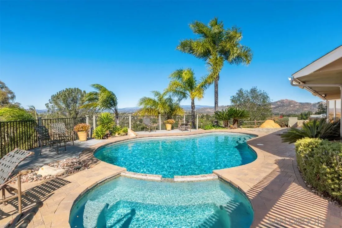 16033 Stoney Acres Road Poway, CA 92064 - Photo 43 of 60 a view of a swimming pool with a patio