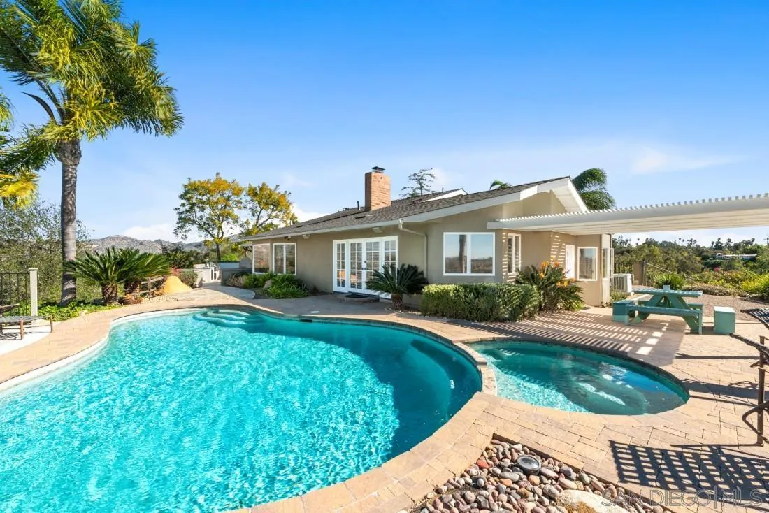 16033 Stoney Acres Road Poway, CA 92064 - Photo 44 of 60 a view of house with garden and swimming pool
