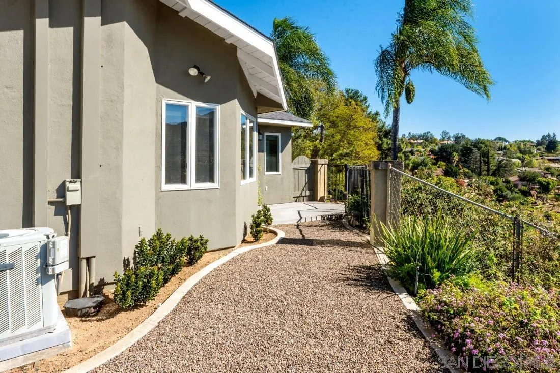 16033 Stoney Acres Road Poway, CA 92064 - Photo 48 of 60 a front view of a house with garden