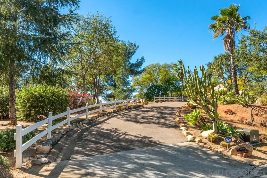 16033 Stoney Acres Road Poway, CA 92064 - Photo 9 of 60 a view of a yard with plants and trees