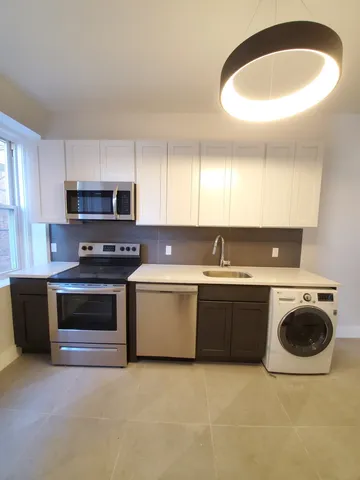 a kitchen with a stove and a microwave