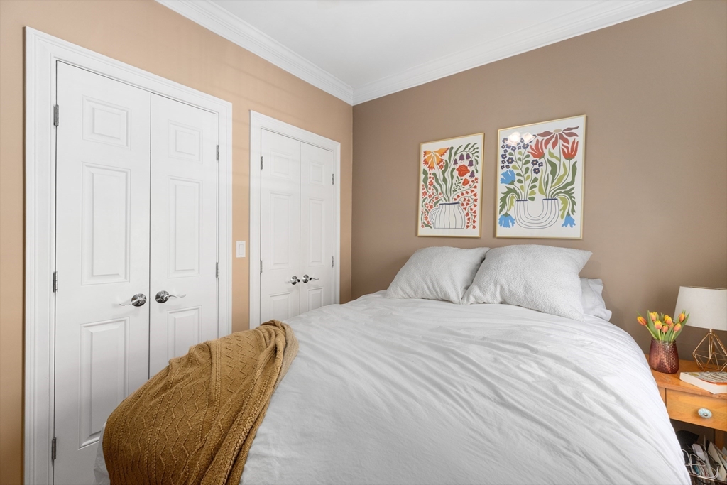 371 Hanover Street, Unit 2 Boston, MA 02113 - Photo 13 of 22 a bedroom with a bed and a chair