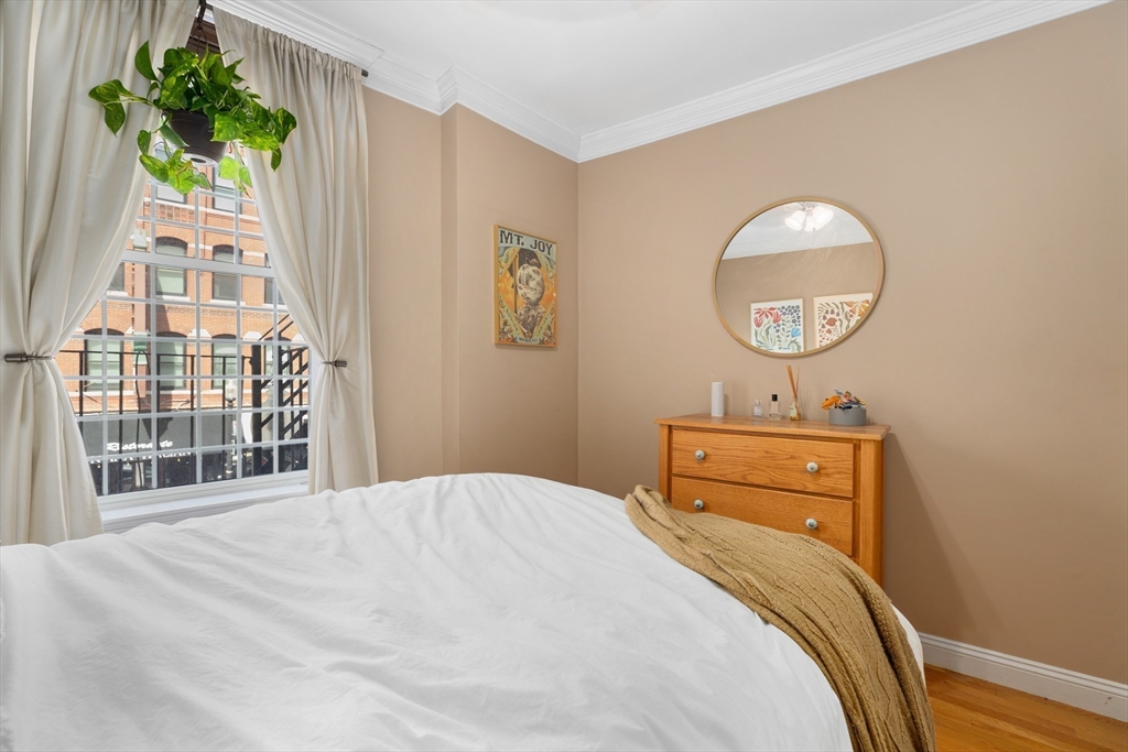 371 Hanover Street, Unit 2 Boston, MA 02113 - Photo 14 of 22 a bedroom with a bed and a window