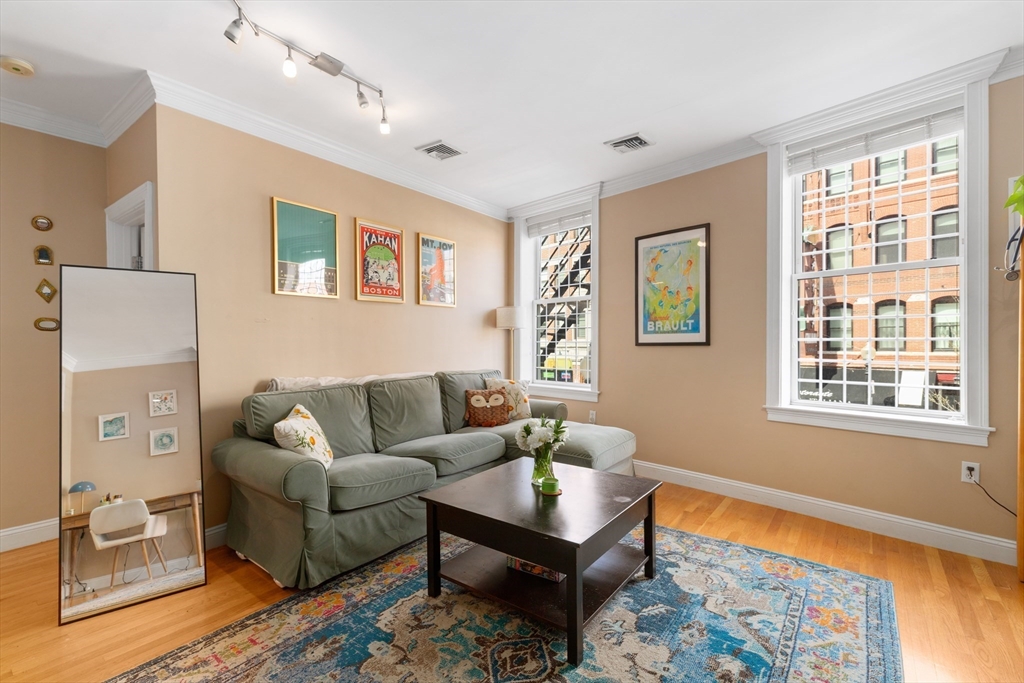 371 Hanover Street, Unit 2 Boston, MA 02113 - Photo 3 of 22 a living room with furniture and a window