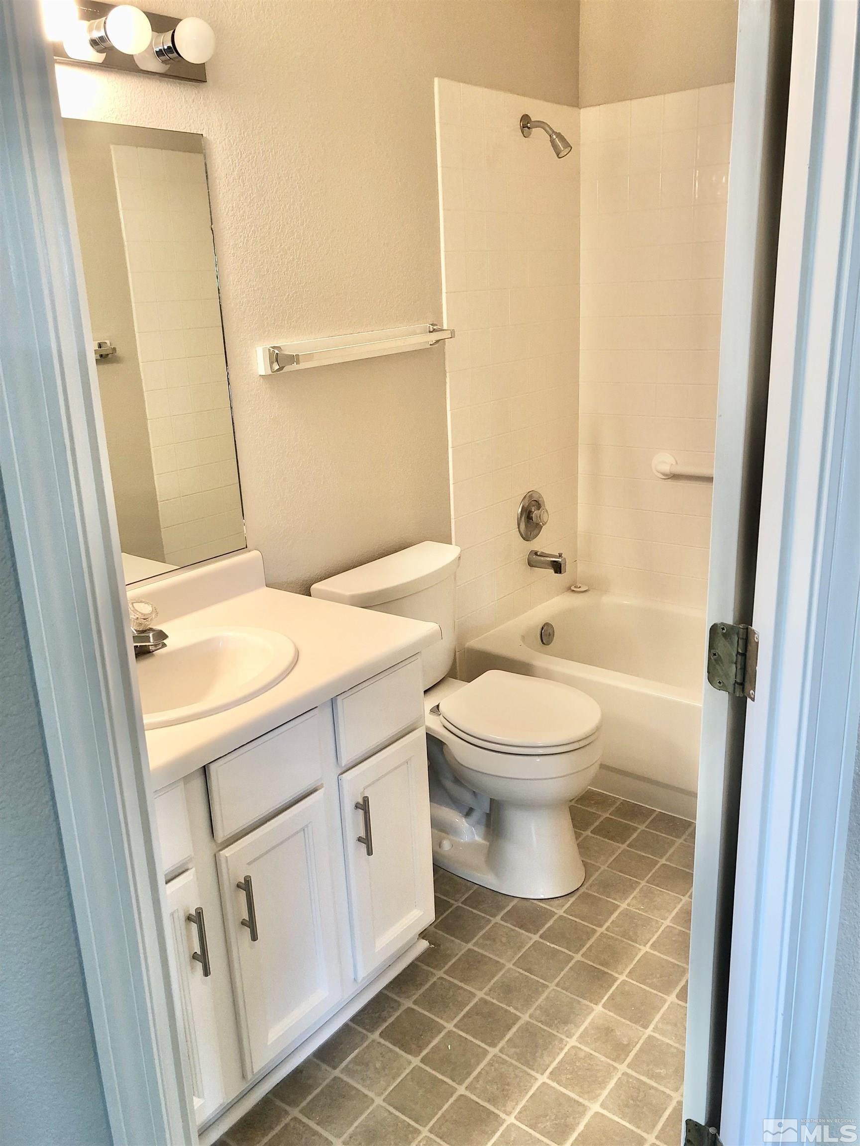 254 Windtree Circle Carson City, NV 89701 - Photo 16 of 23 a bathroom with a toilet sink and a mirror
