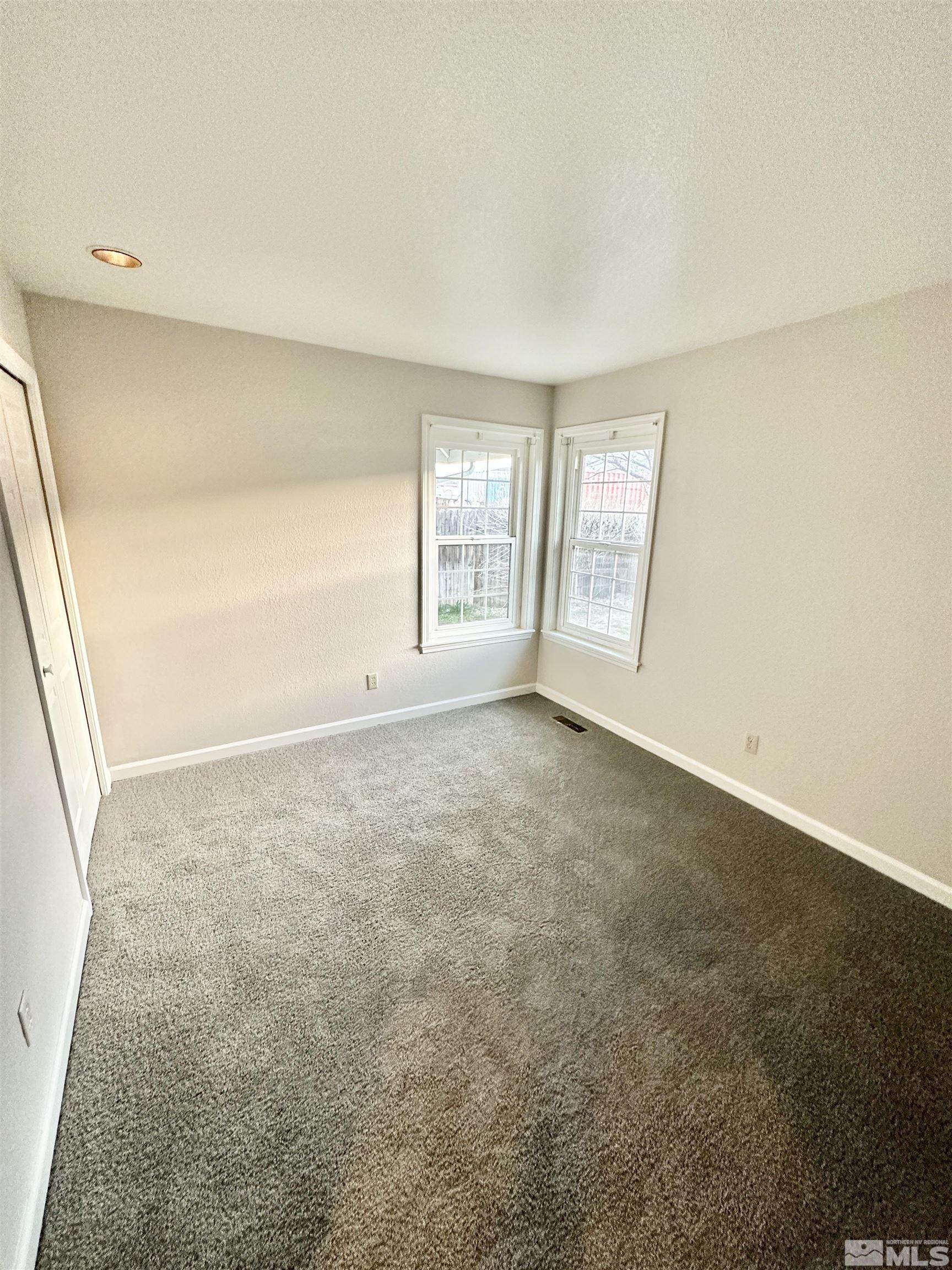 254 Windtree Circle Carson City, NV 89701 - Photo 18 of 23 a view of an empty room with a window
