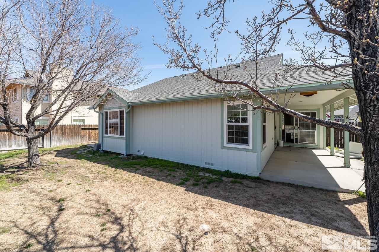 254 Windtree Circle Carson City, NV 89701 - Photo 21 of 23 a view of a house with a yard covered with snow