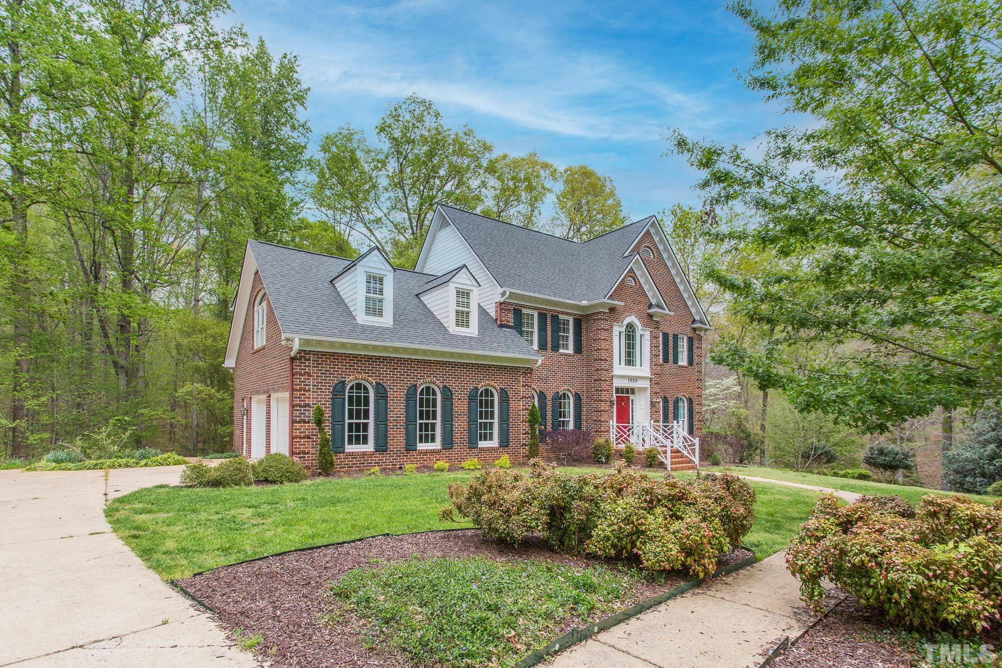 1520 Adams Mountain Road Raleigh, NC 27614 - Photo 3 of 61 front view of a house with a yard