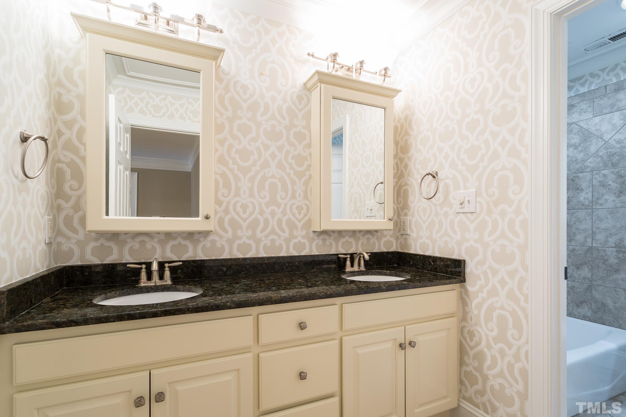 1520 Adams Mountain Road Raleigh, NC 27614 - Photo 34 of 61 a bathroom with a granite countertop sink and a mirror