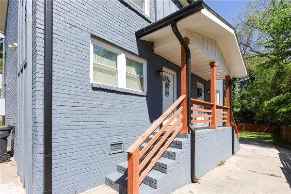 a view of stairs and a yard