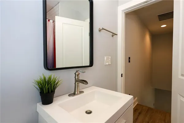 a bathroom with a sink and a mirror