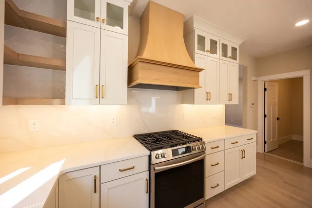 a kitchen with a stove and a refrigerator