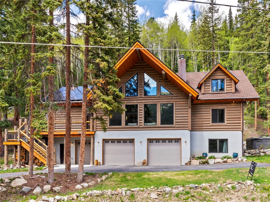 433 97 Circle Blue River, CO 80424 - Photo 2 of 43 a front view of a house with a yard