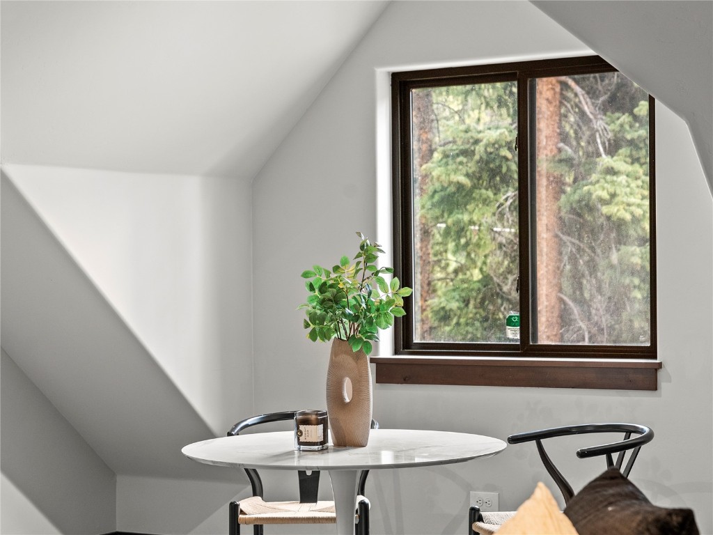 433 97 Circle Blue River, CO 80424 - Photo 22 of 43 a view of a workspace with a table and chair in a room