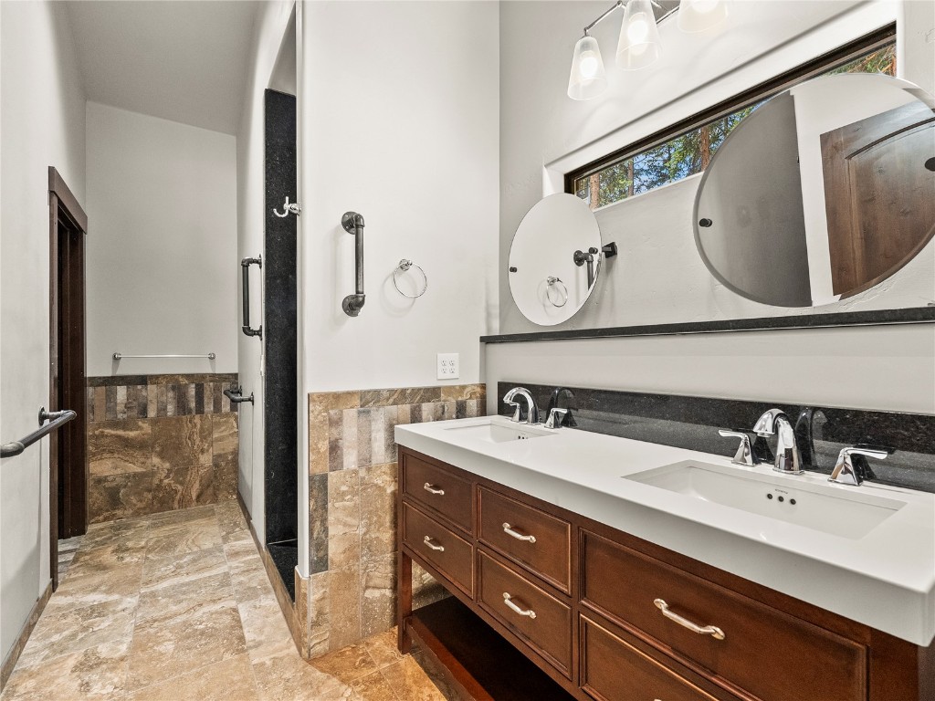 433 97 Circle Blue River, CO 80424 - Photo 30 of 43 a bathroom with a double vanity sink and a mirror