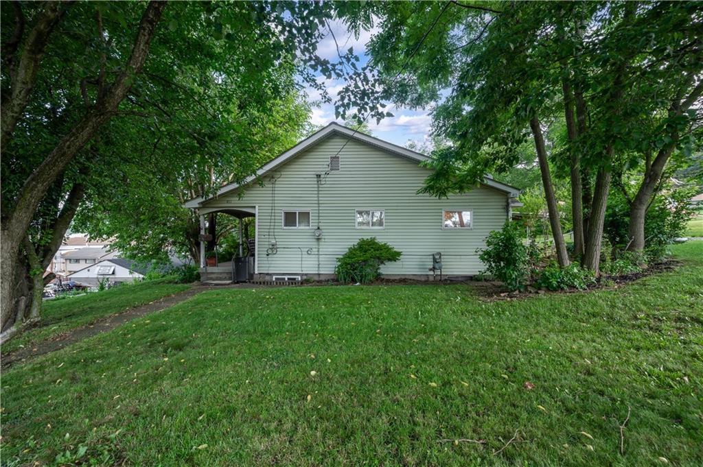 411 Harmony Road Baden, PA 15005 - Photo 3 of 25 a house view with a garden space