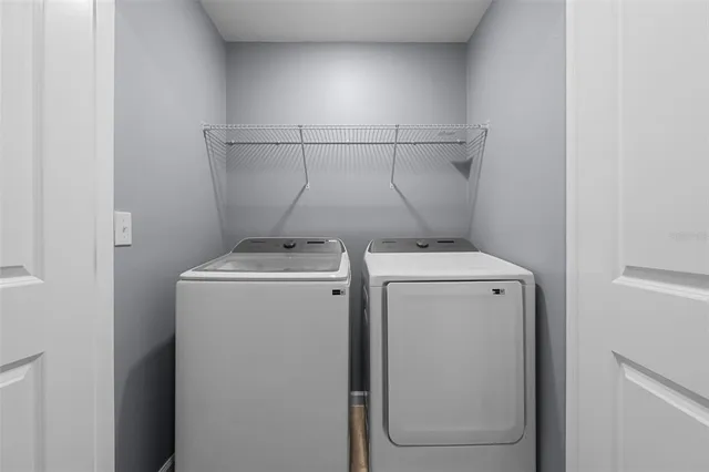 a utility room with dryer and washer