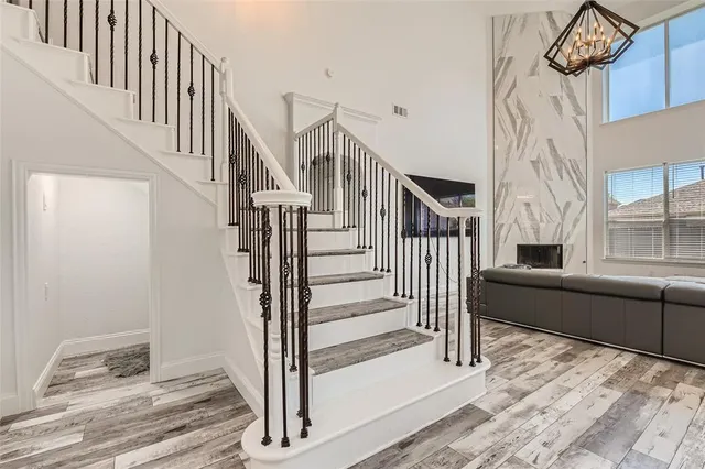 a view of entryway and hall with wooden floor