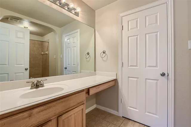 a bathroom with a sink double vanity and a mirror
