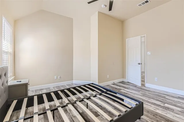 a view of a room with wooden floor