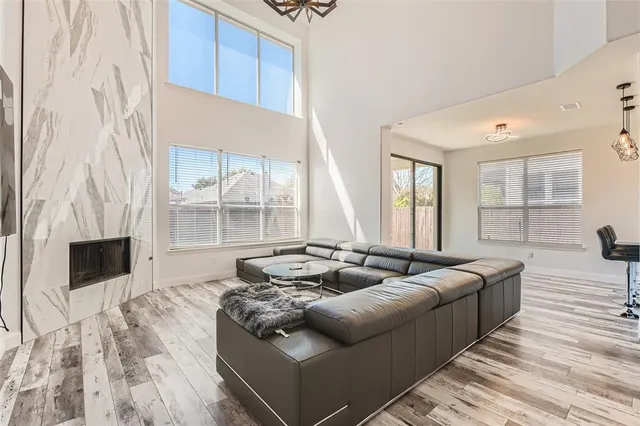 a living room with furniture and a fireplace