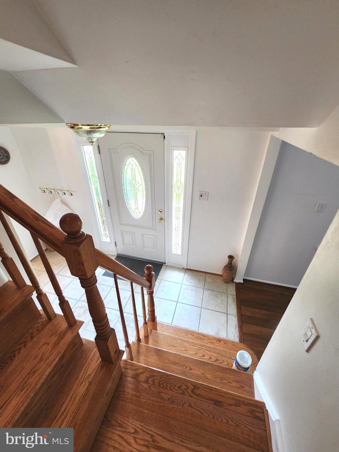 13171 Morning Spring Lane Fairfax, VA 22033 - Photo 7 of 34 a view of entryway kitchen and hall with wooden floor
