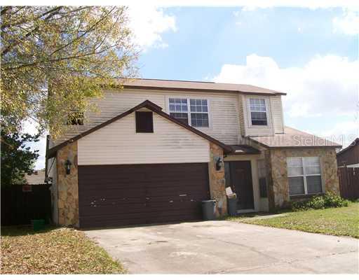 8924 Valencia Gardens Drive Orlando, FL 32825 - Photo 1 of 1 a front view of a house with a yard