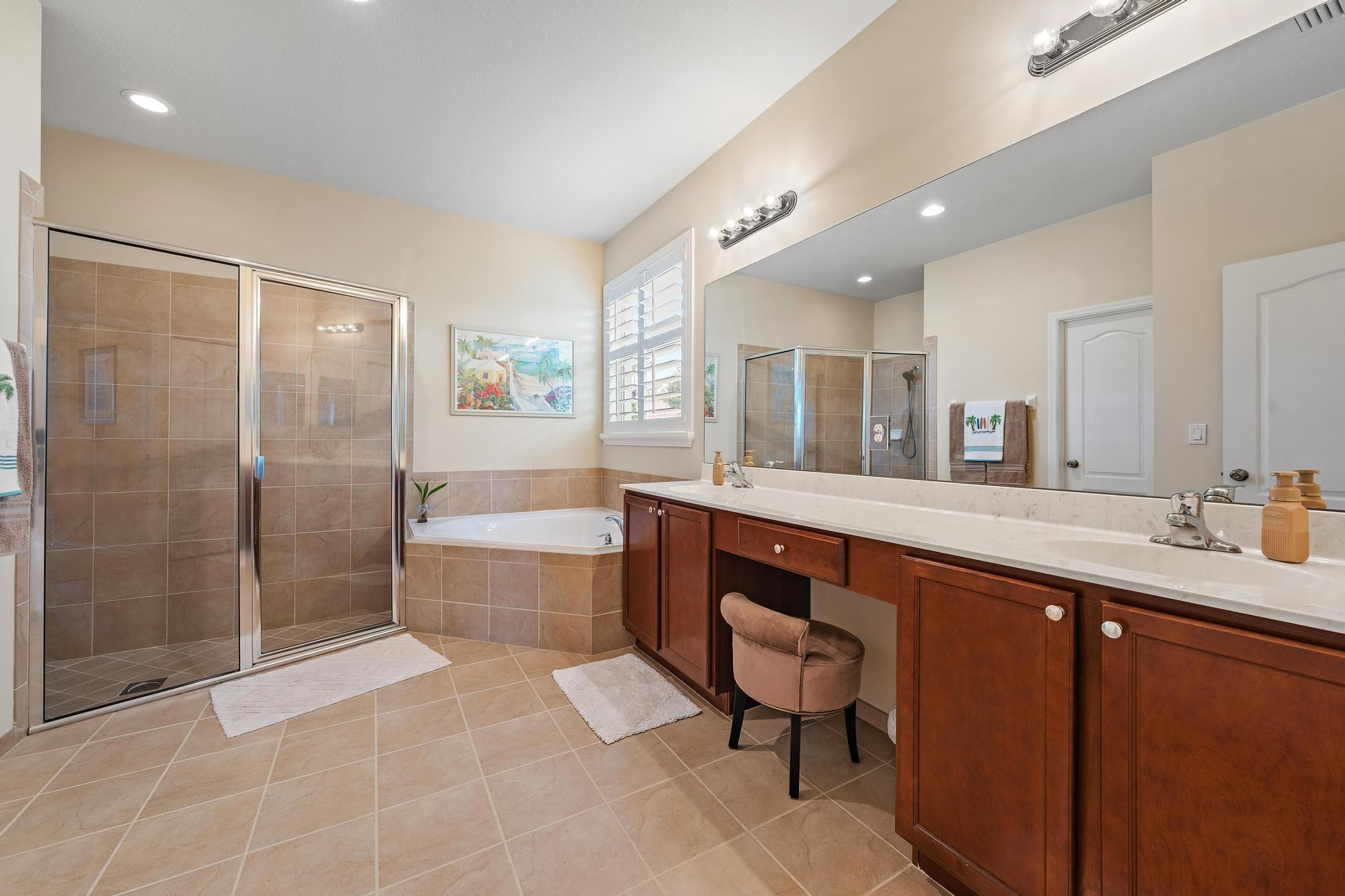 198 Umbrella Place Jupiter, FL 33458 - Photo 18 of 39 a spacious bathroom with a bathtub shower sink and mirror