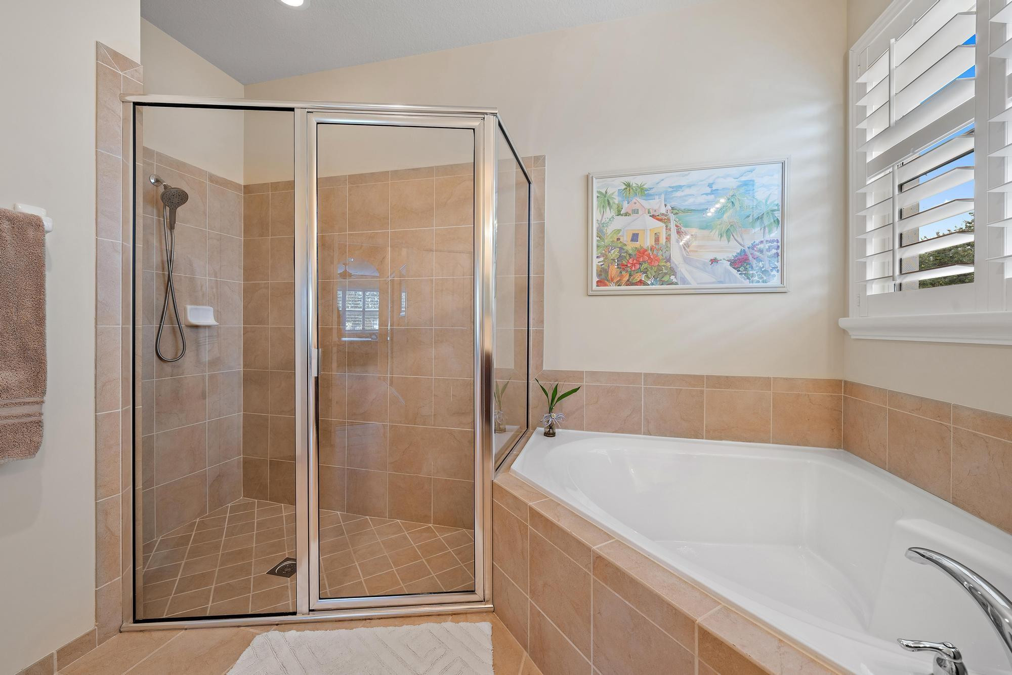 198 Umbrella Place Jupiter, FL 33458 - Photo 19 of 39 a bathroom with a bathtub and a shower