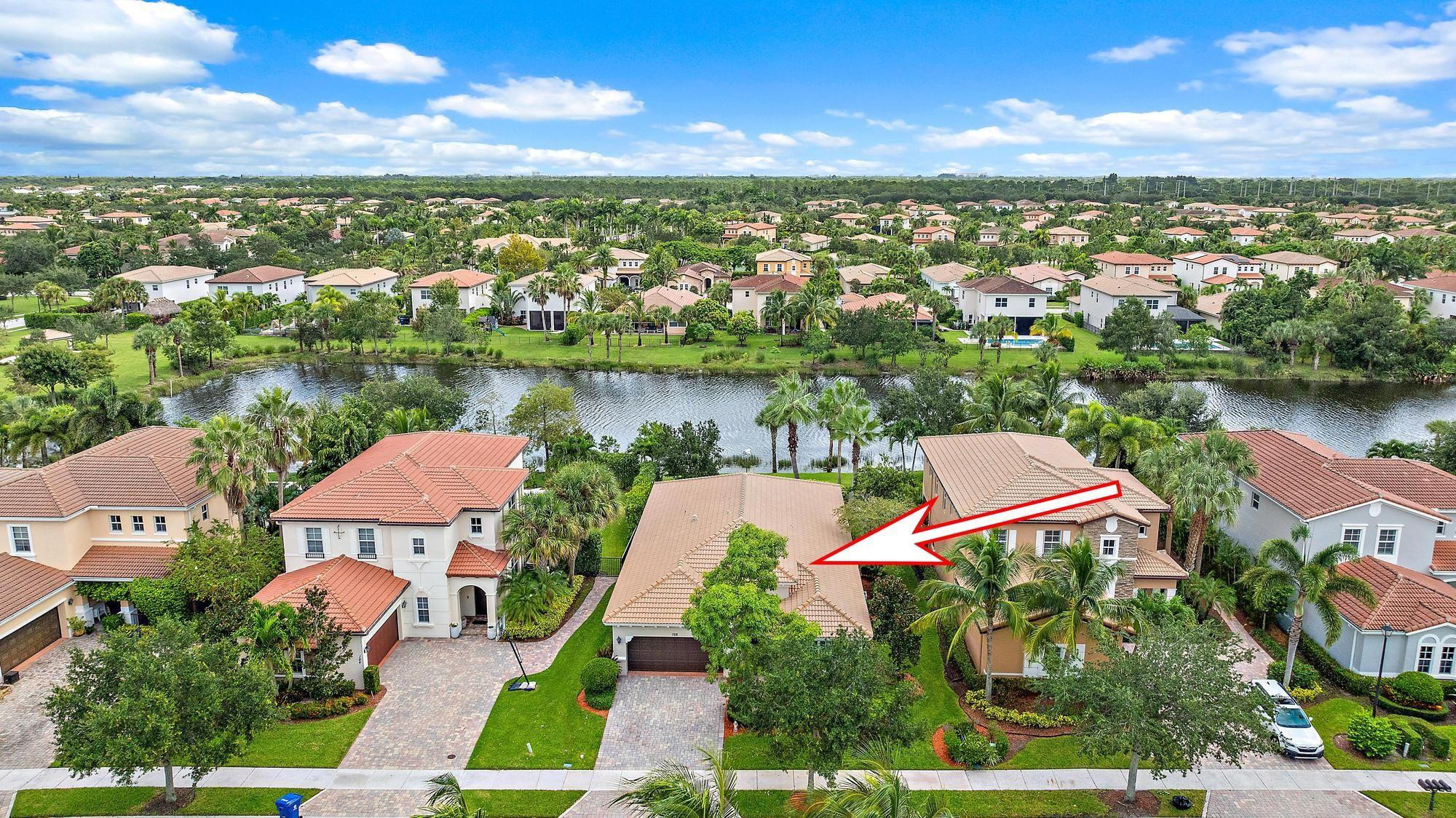 198 Umbrella Place Jupiter, FL 33458 - Photo 2 of 39 an aerial view of residential houses with outdoor space and lake view