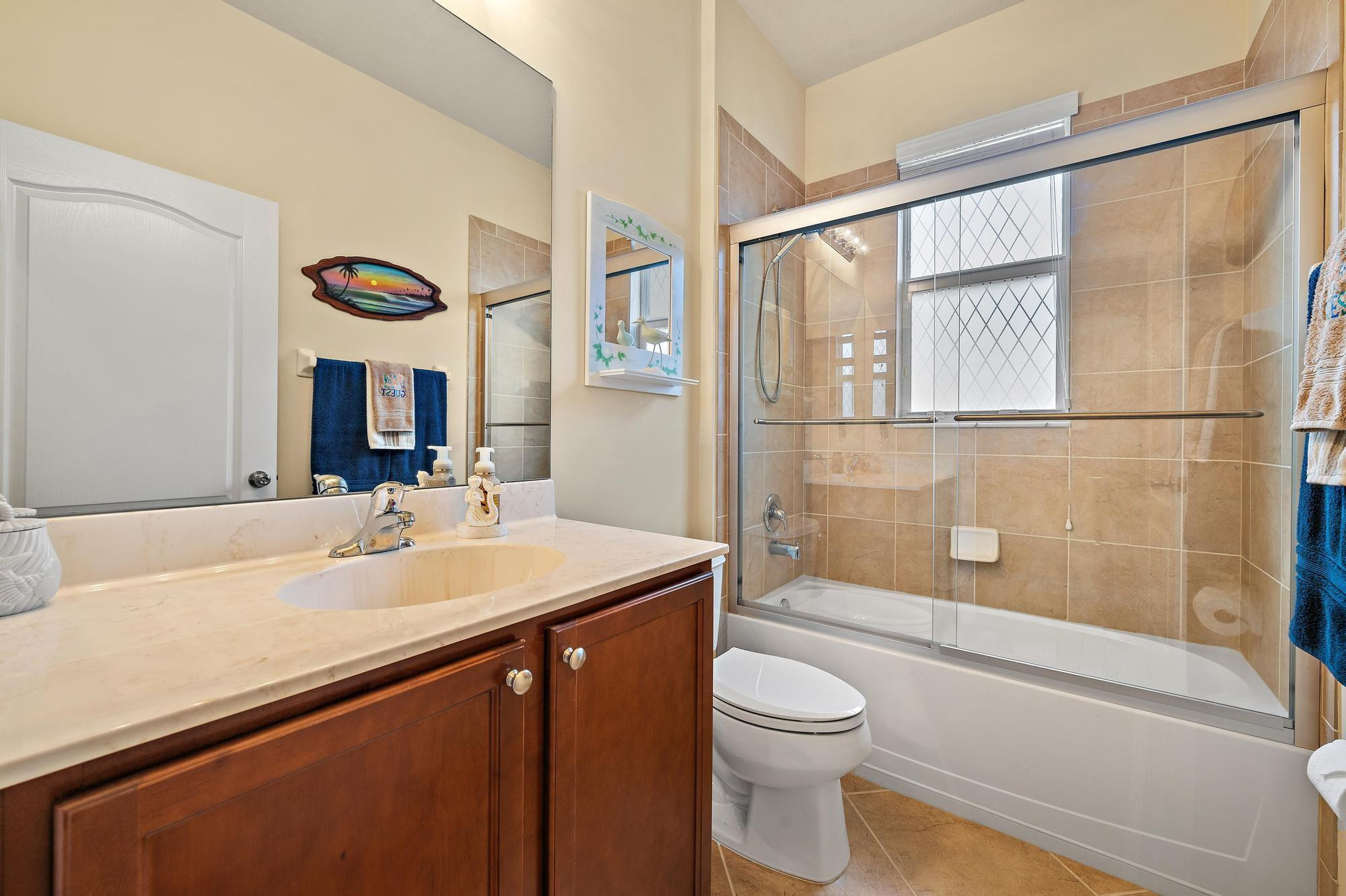 198 Umbrella Place Jupiter, FL 33458 - Photo 22 of 39 a bathroom with a sink a toilet and shower