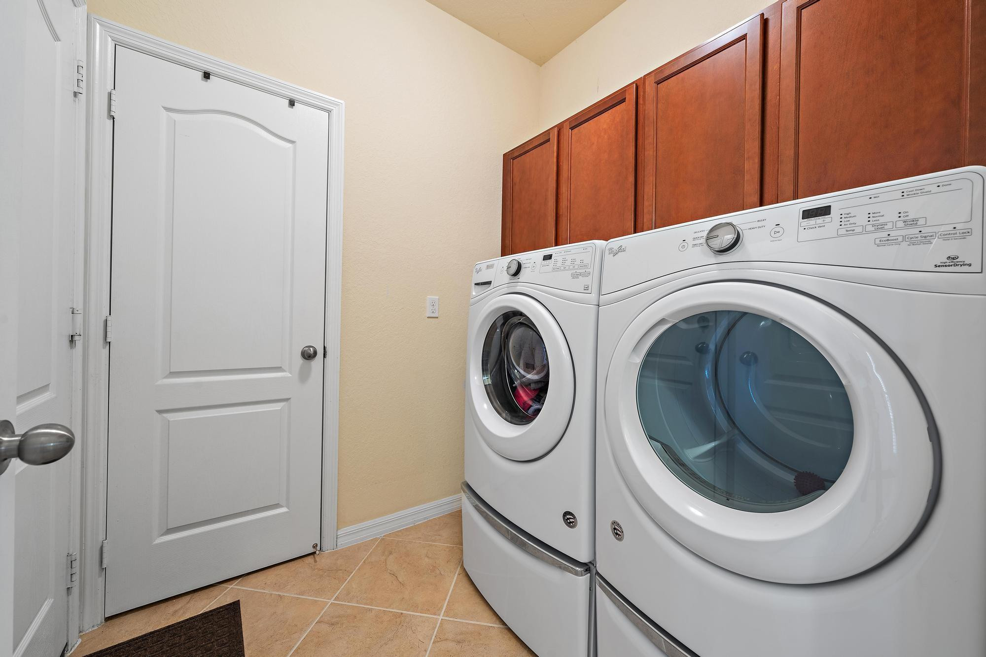 198 Umbrella Place Jupiter, FL 33458 - Photo 23 of 39 a utility room with dryer and washer